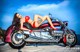 A woman in a red bikini sitting on a motorcycle.